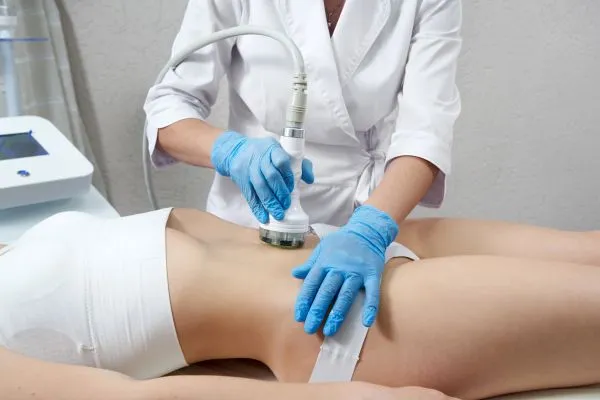 Lost the Weight but Not the Loose Skin? 2 woman having HIFU treatment on her stomach to combat loose skin Little Paxton following weight loss